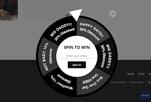 Runners Athletics black and white spin to win wheel doubling as an opt in form